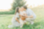 parents kissing daughter