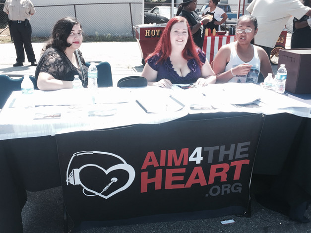 Members Sophie, Colleen and Liz at Aim table Expressive Arts Festival