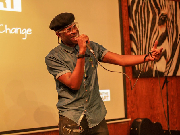 Singer/Songwriter Jarette Romero performs his original song during Change the Tune event