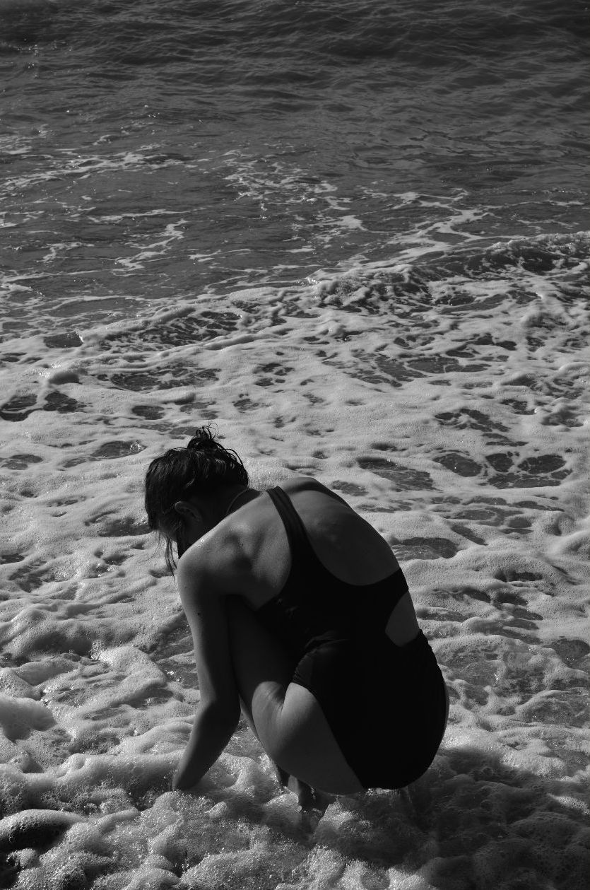 woman sitting in the water
