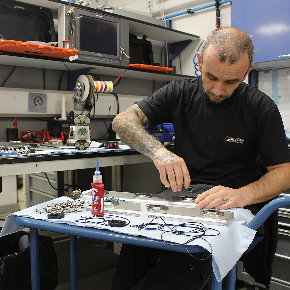 Service Technician re-building crawler following rotine maintenace
