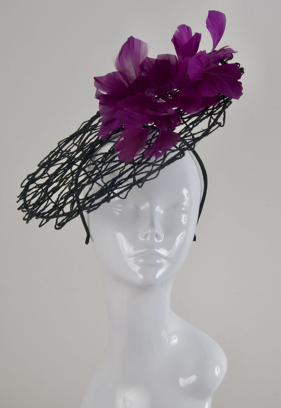 Thumbnail: Black fascinator with plum feathers