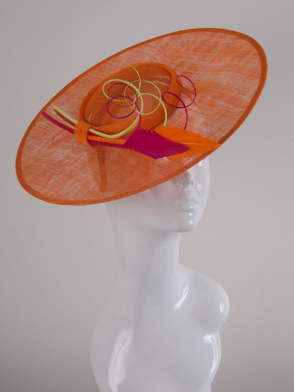 Thumbnail: Orange hat with pink and yellow trimmings side view