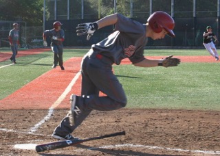 Pascal Brassey hustles to 1st as Eric Doctor heads to home with Coach Firenzi looking on