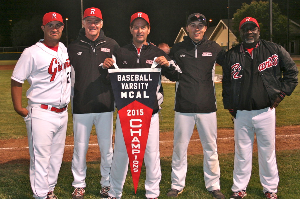 The Redwood Coaching Staff proudly hold the MCAL Banner after the game.  From left to right, Joel Russo, Rich Ependio, Head Coach Mike Firenzi, Freshman Coach Taber Watson, and Tim Grayson