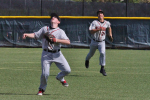 Michael Connors, backed up by Dane Goodman, prepares to catch a fly ball in the third inning.