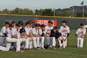 The team awaits a post-victory talk with coaches