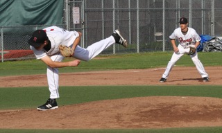 Zack Kopstein fires strike three as Eric Doctor looks on