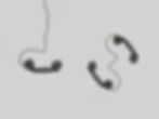 Light gray background with old style phone handset with cords attached