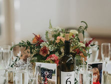 Mid-June wedding at Potomac Point Winery featuring timeless peaches and creams with rich wine-colored accents and early dahlias, designed by The Fertile Burb in Virginia.