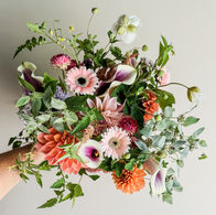 Locally grown summer bouquet with pastel pinks, creamy whites, bold orange, and fresh greens, Northern Virginia.