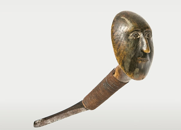Full side view of a historic Iroquois human visage crooked knife, circa 1780-1800, published in Sacred Circles and Mocotaugan: The Story and Art of the Crooked Knife.