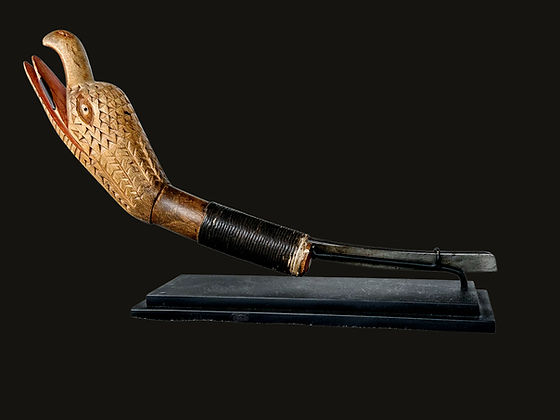Full view of an iconic eagle effigy mocotaugan crooked knife by Eli Croft of Camperdown, Nova Scotia, emblematic of traditional Nova Scotia folk art traditions.