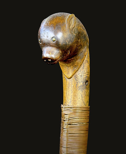 Left-facing partial view of a rare Penobscot bear cub effigy crooked knife, circa 1860-1880, featuring a repurposed file blade. Ex: Bill Martha collection.