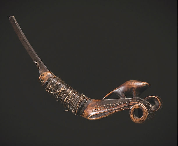 Full view of a historic Maliseet beaver effigy crooked knife dated 1814, featuring wrapped handle and repurposed European steel blade. Museum of Fine Arts Boston.