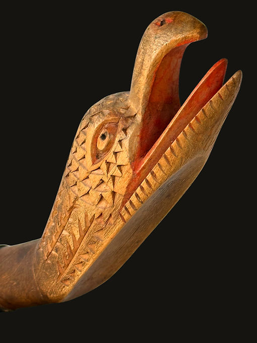 Close-up of the carved eagle's head detail on an iconic effigy crooked knife by Eli Croft of Camperdown, Nova Scotia, circa 1860-1935, featured in the 1985 Spirit of Nova Scotia exhibition.