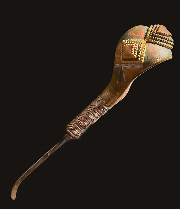 Full view of a historic Micmac or Maliseet polychrome chip-carved crooked knife, Canadian Maritimes, circa 1850-1875. Exhibited in Folk Art of Nova Scotia, 1976.