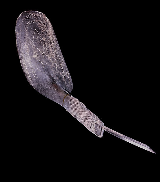 Full front view of an unusual large paddle-shaped mocotaugan crooked knife, Penobscot, Indian Island, Maine, circa 1850-1870. Field collected by a Maine State Museum curator in the 1960s.