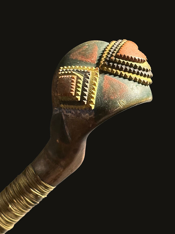 Close-up of polychrome chip carving and brass wire on a historic Micmac or Maliseet crooked knife from the Canadian Maritimes, circa 1850-1875. Ex: Ned Jalbert and Thomas Lackey collections.