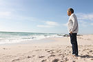 side-view-of-biracial-senior-man-standing-on-shore-2023-11-27-04-58-41-utc.jpg