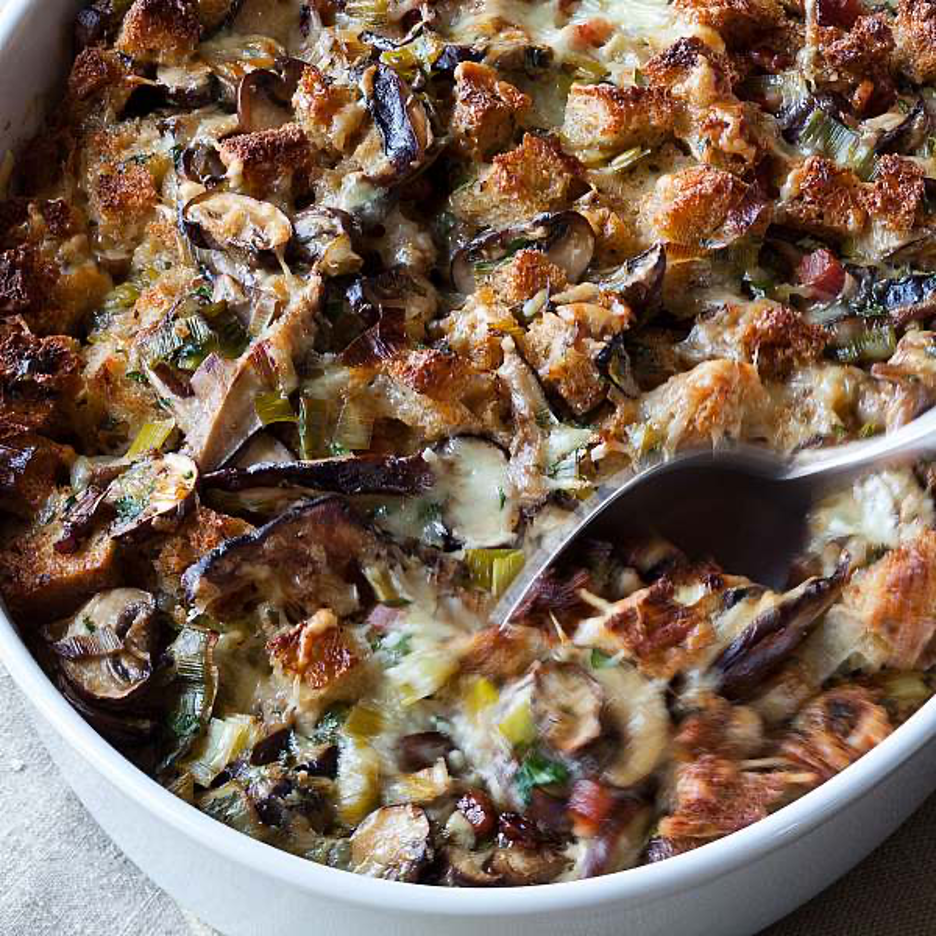 Savory bread pudding layered with mushrooms, leeks, pancetta, and Gruyère, this Barefoot Contessa recipe is rich, comforting, and perfect for Thanksgiving.
