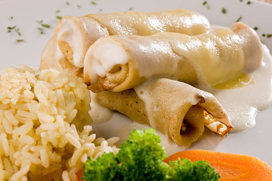Tender chicken folded into crepes with a creamy curry-scented sauce, topped with cheese and baked until golden.