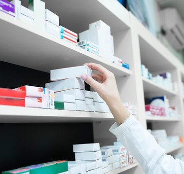 closeup-view-pharmacist-hand-taking-medicine-box-from-shelf-drug-store.jpg