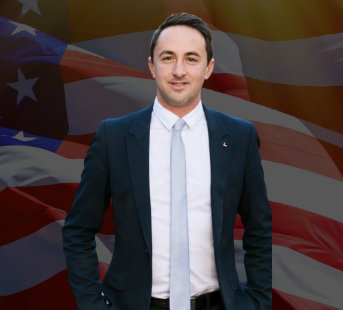 “Nic Fren, founder of Real Estate Today, stands confidently in front of the American flag, symbolising the official U.S. launch of Australia’s #1 real estate industry publication. RET expands its social-first, agent-focused media model into the United States, celebrating realtors, community stories, innovation and industry impact.”