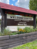 Coker Creek Welcome Center Sign showcasing the Unicoi Turnpike and Cherokee National Forest 