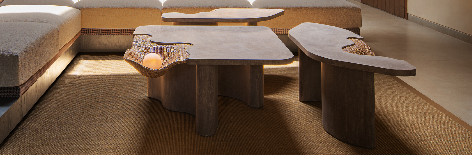 Isometric view of 3 irregular concrete coffee tables styled together in a modern living room, Styling concrete coffee tables in living room.