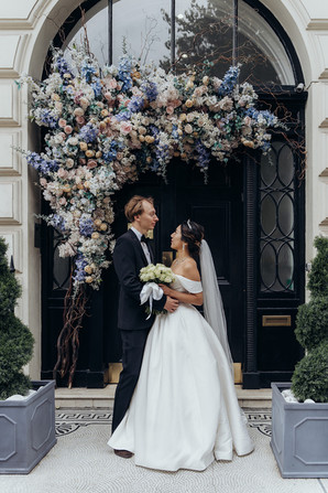 After the ceremony, we embarked on a breathtaking journey through some of London’s most picturesque locations. Our first stop was Park Crescent, where the couple posed gracefully against the backdrop of elegant Regency architecture. The stunning symmetry and classic style of the crescent provided a timeless aesthetic for their wedding portraits.  From there, we moved to Regent Street, capturing candid and romantic moments amid the hustle and bustle of London’s vibrant heart. The grand buildings and festive atmosphere made for striking wedding photography, blending modern energy with timeless romance.  To round off the day, we traveled to Westminster, where Vadim and Yu stood before some of London’s most recognizable landmarks. From Big Ben to the Houses of Parliament, every shot captured the essence of their love story in the city’s most iconic settings. These final moments created breathtaking memories that will last a lifetime.