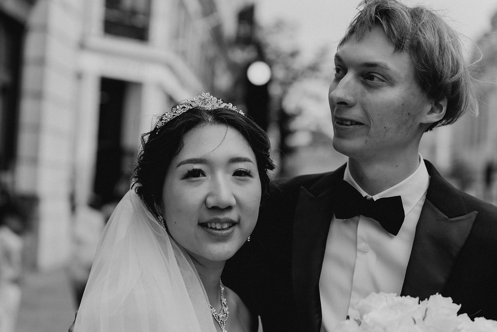 After the ceremony, we embarked on a breathtaking journey through some of London’s most picturesque locations. Our first stop was Park Crescent, where the couple posed gracefully against the backdrop of elegant Regency architecture. The stunning symmetry and classic style of the crescent provided a timeless aesthetic for their wedding portraits.  From there, we moved to Regent Street, capturing candid and romantic moments amid the hustle and bustle of London’s vibrant heart. The grand buildings and festive atmosphere made for striking wedding photography, blending modern energy with timeless romance.  To round off the day, we traveled to Westminster, where Vadim and Yu stood before some of London’s most recognizable landmarks. From Big Ben to the Houses of Parliament, every shot captured the essence of their love story in the city’s most iconic settings. These final moments created breathtaking memories that will last a lifetime.