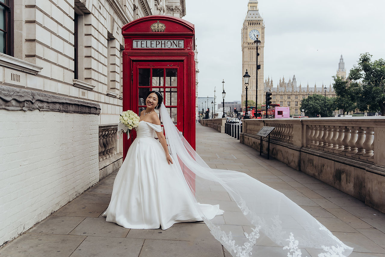 After the ceremony, we embarked on a breathtaking journey through some of London’s most picturesque locations. Our first stop was Park Crescent, where the couple posed gracefully against the backdrop of elegant Regency architecture. The stunning symmetry and classic style of the crescent provided a timeless aesthetic for their wedding portraits.  From there, we moved to Regent Street, capturing candid and romantic moments amid the hustle and bustle of London’s vibrant heart. The grand buildings and festive atmosphere made for striking wedding photography, blending modern energy with timeless romance.  To round off the day, we traveled to Westminster, where Vadim and Yu stood before some of London’s most recognizable landmarks. From Big Ben to the Houses of Parliament, every shot captured the essence of their love story in the city’s most iconic settings. These final moments created breathtaking memories that will last a lifetime.