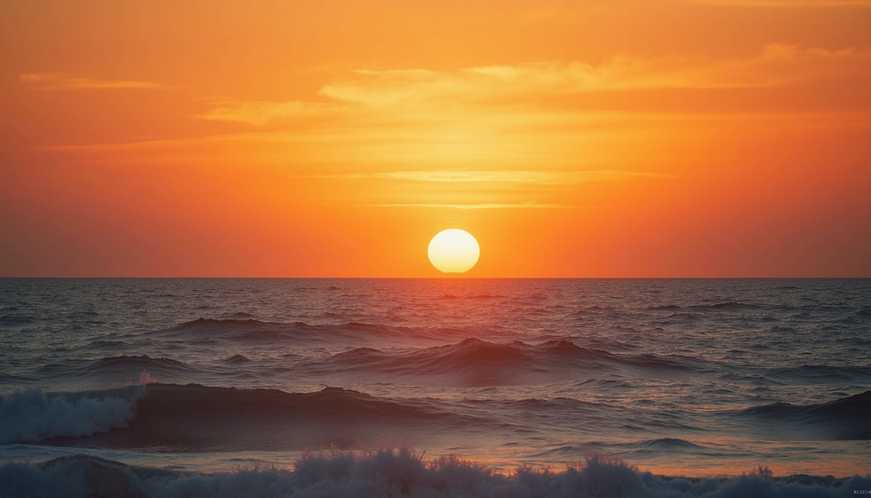 Wide angle view of sunset over the ocean horizon