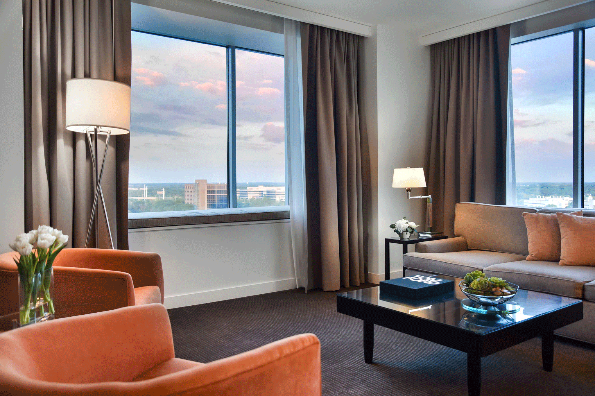 A guest suite living area, bedroom and luxury bath at Hotel Arista in an image rotation