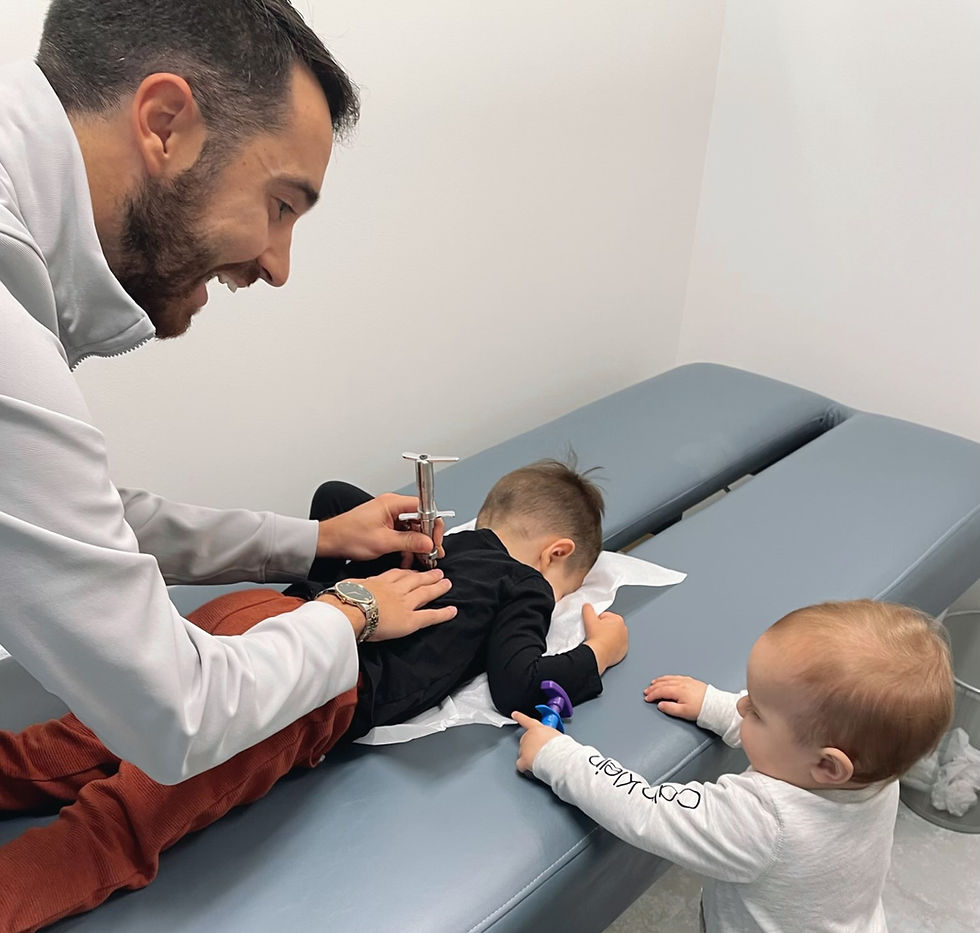 Close-up view of a chiropractic adjustment session for pediatric patients