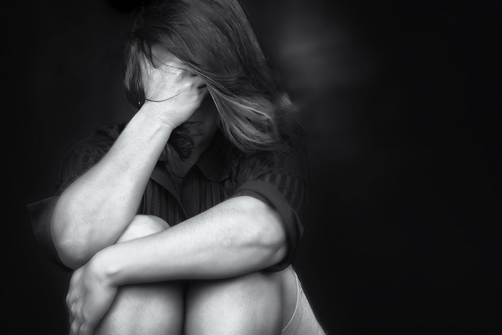 Woman crying with a dark background