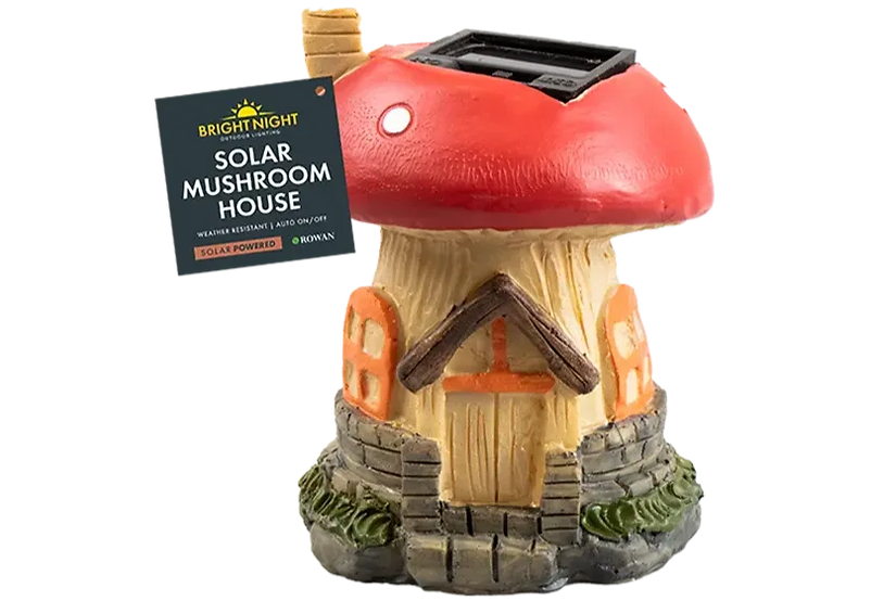 Solar-powered mushroom-shaped house with a red cap and stone base. Sign reads: Bright Night Solar Mushroom House. Weather resistant.