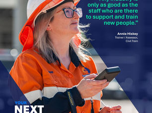 Diverse construction workers reviewing plans on a modern Australian building site, representing workforce development by BuildSkills Australia.