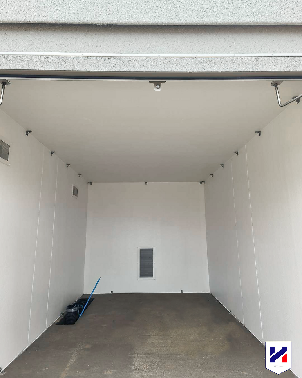 Inside of the Bespoke GRP enclosure installed on site with steel doors, louvred ventilation and a durable external finish.