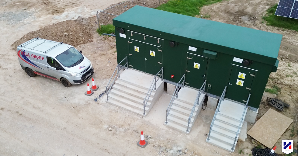Hill Grwp Ltd van beside a GRP substation enclosure installed on a solar farm project