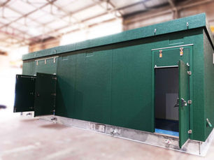 Large green GRP substation enclosure in the Hill Grwp factory, awaiting the delivery
