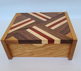 Treasure Box made with a combination of maple, walnut and cherry hardwoods.