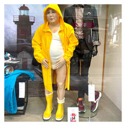 shopping window urgent man in yellow raincoat 2