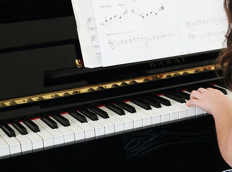 Girl Playing Beginner Piano_edited.jpg