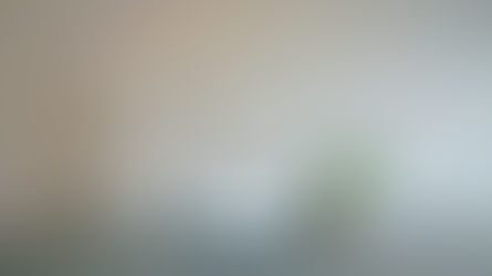 A large desk, featuring the letters SEO, next to a laptop where a person would perform search engine optimization