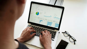 A man checking the lead generation data for his website.