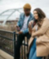 A couple drinking LURE THC mocktails in the park.