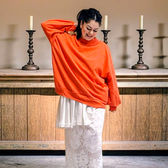 Vintage lace tablecloth skirt. Ali in front of brass candleholders