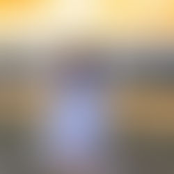 Ali wearing a lace tiered Free People romper in the sunset kissed hour